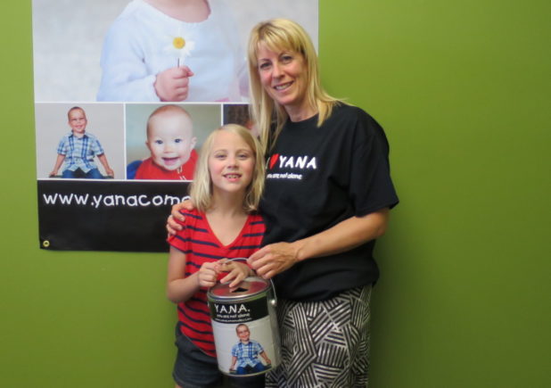 sadie with proceeds from her lemonade stand at Queneesh